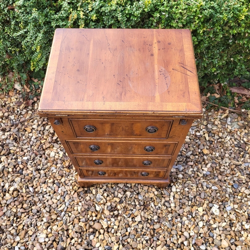 355 - A REGENCY STYLE YEW PEDESTAL CHEST
The fold over top with green tooled leather writing surface above... 