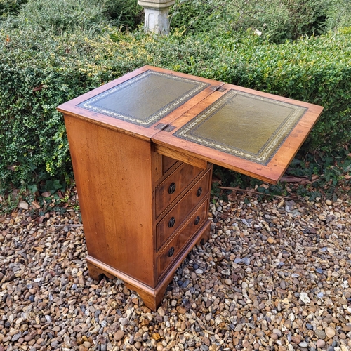 355 - A REGENCY STYLE YEW PEDESTAL CHEST
The fold over top with green tooled leather writing surface above... 