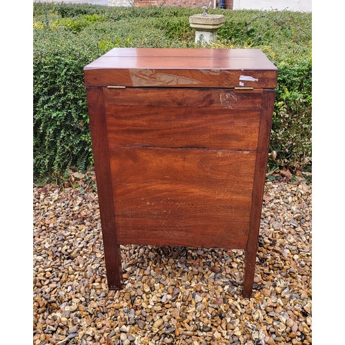 357 - A GEORGIAN MAHOGANY GENTLEMAN'S WASHSTAND
The fold over top enclosing a fitted interior above cupboa... 