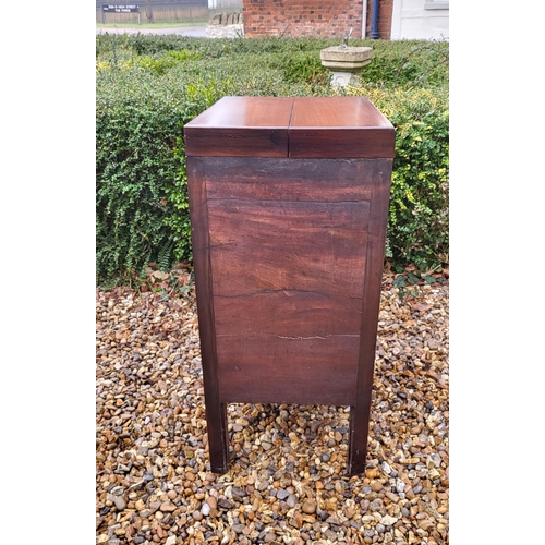 357 - A GEORGIAN MAHOGANY GENTLEMAN'S WASHSTAND
The fold over top enclosing a fitted interior above cupboa... 