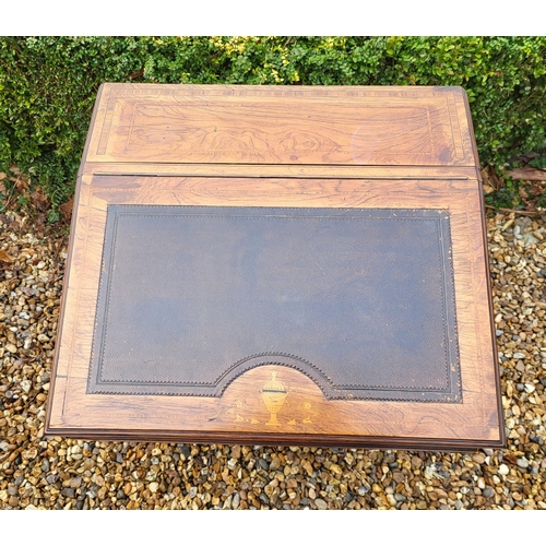 358 - A LATE VICTORIAN ROSEWOOD AND MARQUETRY INLAID DAVENPORT DESK
The rise and fall top enclosing and bi... 