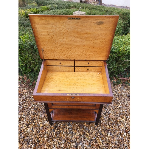 358 - A LATE VICTORIAN ROSEWOOD AND MARQUETRY INLAID DAVENPORT DESK
The rise and fall top enclosing and bi... 