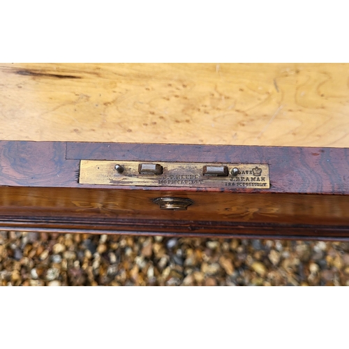 358 - A LATE VICTORIAN ROSEWOOD AND MARQUETRY INLAID DAVENPORT DESK
The rise and fall top enclosing and bi... 