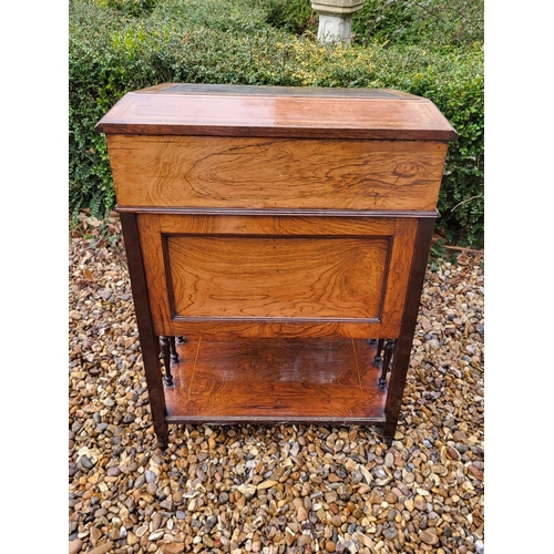 358 - A LATE VICTORIAN ROSEWOOD AND MARQUETRY INLAID DAVENPORT DESK
The rise and fall top enclosing and bi... 