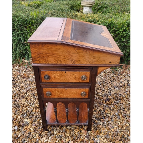 358 - A LATE VICTORIAN ROSEWOOD AND MARQUETRY INLAID DAVENPORT DESK
The rise and fall top enclosing and bi... 