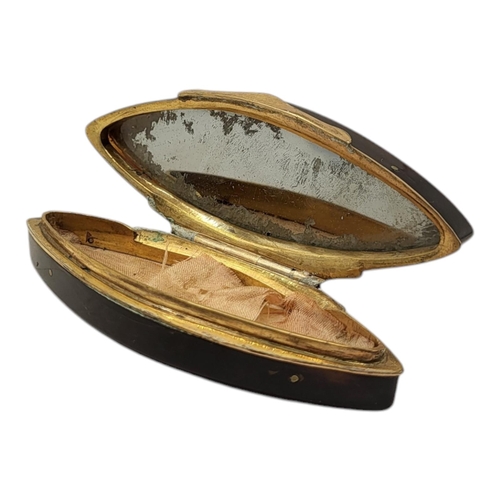 36 - A GEORGIAN YELLOW METAL TORTOISESHELL SNUFF BOX
Lozenge form, with inlaid decoration and mirror to l... 