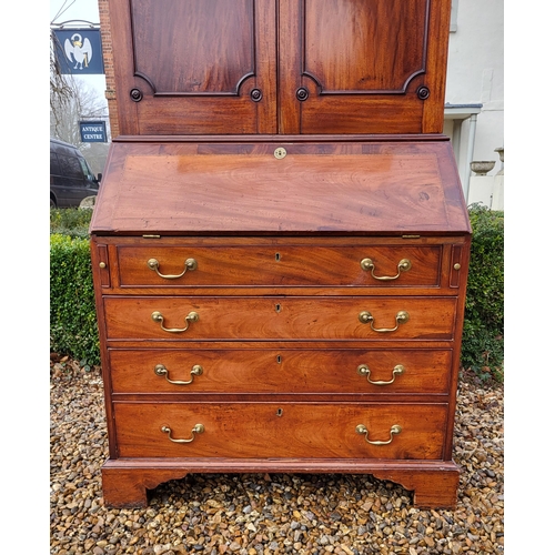 361 - AN 18TH CENTURY SOLID MAHOGANY NEO CLASSICAL BUREAU BOOKCASE 
With architectural pediment above two ... 