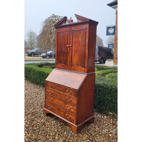 361 - AN 18TH CENTURY SOLID MAHOGANY NEO CLASSICAL BUREAU BOOKCASE 
With architectural pediment above two ... 