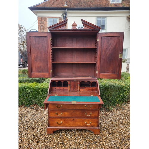 361 - AN 18TH CENTURY SOLID MAHOGANY NEO CLASSICAL BUREAU BOOKCASE 
With architectural pediment above two ... 