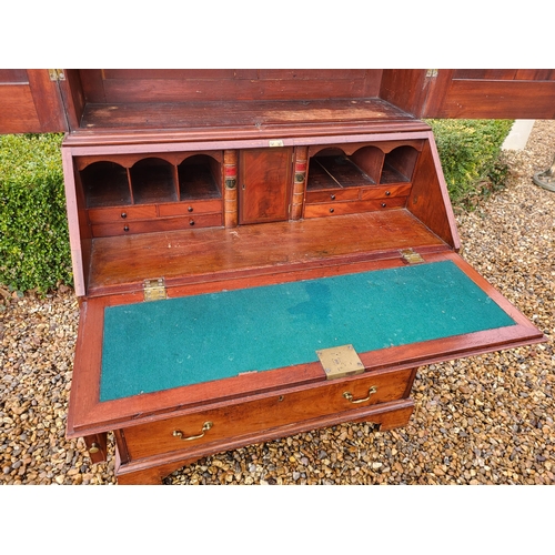 361 - AN 18TH CENTURY SOLID MAHOGANY NEO CLASSICAL BUREAU BOOKCASE 
With architectural pediment above two ... 