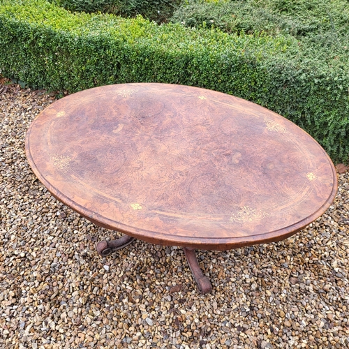 362 - A VICTORIAN BURR WALNUT LOO TABLE
The oval top supported on a carved bulbous column with four splaye... 