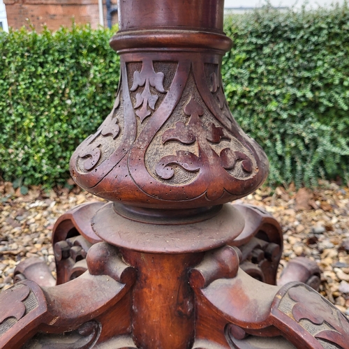 362 - A VICTORIAN BURR WALNUT LOO TABLE
The oval top supported on a carved bulbous column with four splaye... 