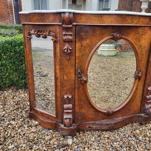 363 - A VICTORIAN BURR AND FIGURED WALNUT SIDE CABINET/CREDENZA 
With white marble serpentine top above an... 