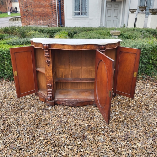 363 - A VICTORIAN BURR AND FIGURED WALNUT SIDE CABINET/CREDENZA 
With white marble serpentine top above an... 