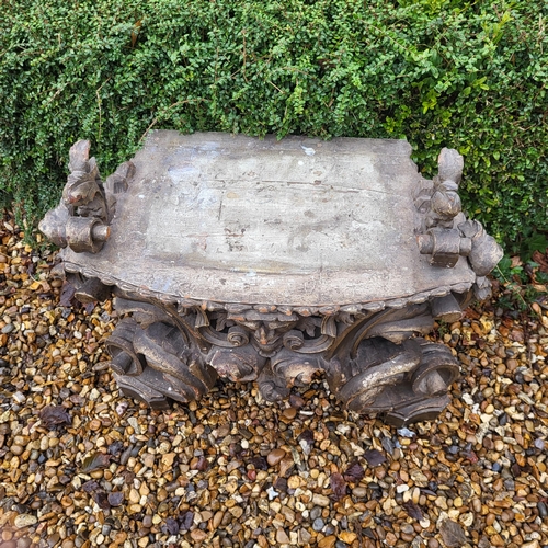 367 - AN 18TH/19TH CENTURY ITALIAN CARVED GILTWOOD LOW CONSOLE TABLE
With scrolling foliage legs centred w... 