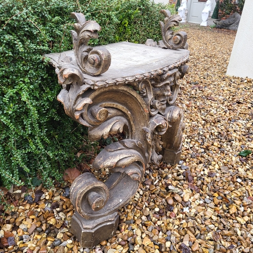 367 - AN 18TH/19TH CENTURY ITALIAN CARVED GILTWOOD LOW CONSOLE TABLE
With scrolling foliage legs centred w... 