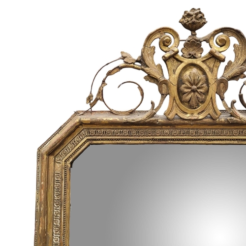 372 - A LARGE  EARLY 19TH CENTURY GILT FRAMED MIRROR
With floral cartouche above mercury plate with canted... 