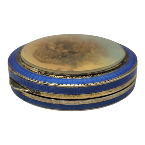 45 - AN EARLY 20TH CENTURY CONTINENTAL SILVER AND ENAMEL POWDER COMPACT
Blue guilloché enamel with dried ... 