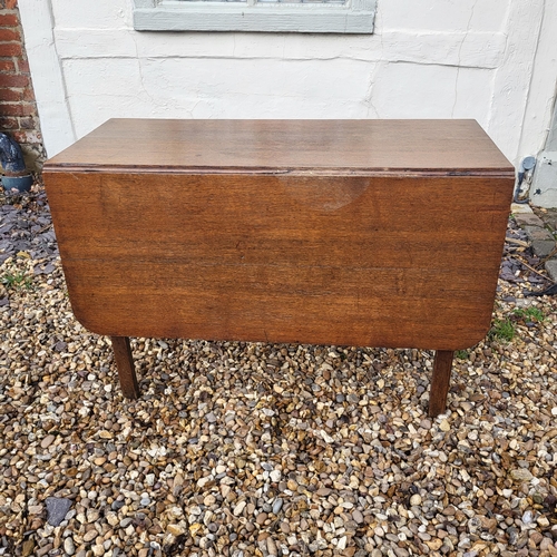 377 - A GEORGIAN SOLID MAHOGANY DROP LEAF DINING TABLE
Raised on turned legs with pad feet, complete with ... 