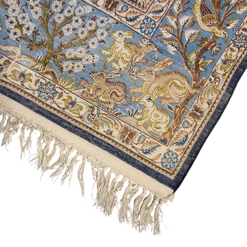 267 - A VINTAGE PERSIAN SILK ‘SHAHREZA TREE OF LIFE ‘ RUG
The central arched field woven with animals and ... 