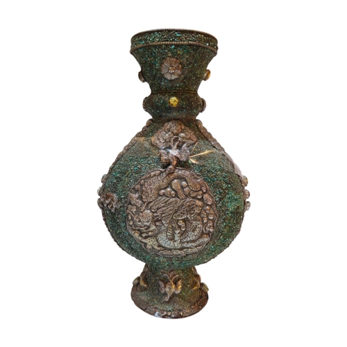 269 - A 20TH CENTURY ASIAN WHITE METAL AND TURQUOISE MOON FLASK/VASE
Applied white metal decoration of a P... 