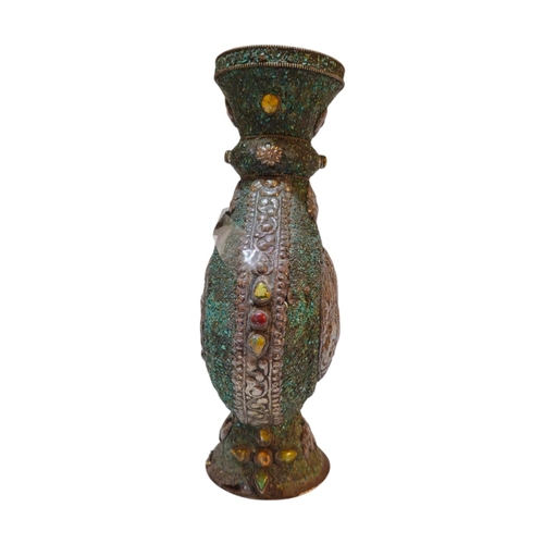269 - A 20TH CENTURY ASIAN WHITE METAL AND TURQUOISE MOON FLASK/VASE
Applied white metal decoration of a P... 