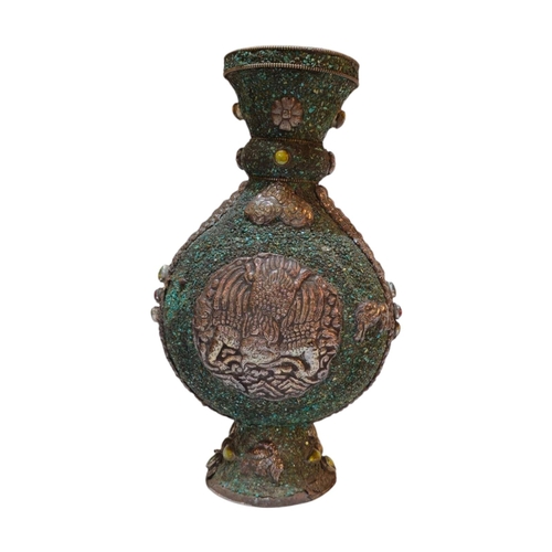 269 - A 20TH CENTURY ASIAN WHITE METAL AND TURQUOISE MOON FLASK/VASE
Applied white metal decoration of a P... 
