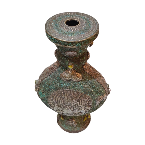 269 - A 20TH CENTURY ASIAN WHITE METAL AND TURQUOISE MOON FLASK/VASE
Applied white metal decoration of a P... 