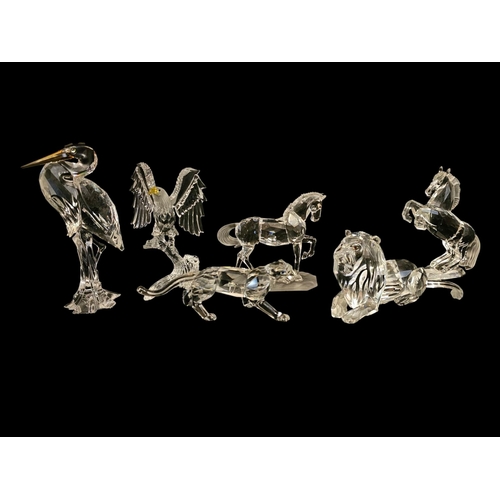 285 - SWAROVSKI, A COLLECTION OF SIX VINTAGE CRYSTAL GLASS FIGURES
Comprising a lion and lioness, two hors... 