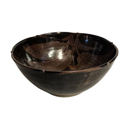 290 - A MID CENTURY ART POTTERY BOWL
iridescent glaze with leaf design,impressed mark to rim Initialed ‘SE... 