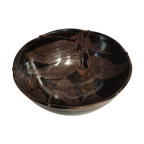 290 - A MID CENTURY ART POTTERY BOWL
iridescent glaze with leaf design,impressed mark to rim Initialed ‘SE... 