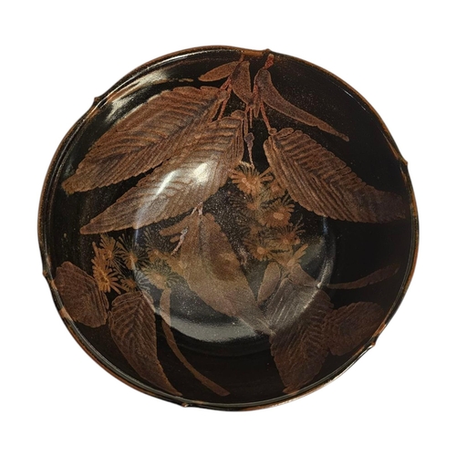 290 - A MID CENTURY ART POTTERY BOWL
iridescent glaze with leaf design,impressed mark to rim Initialed ‘SE... 