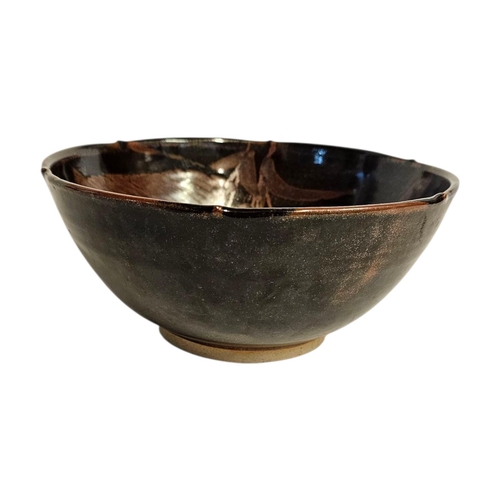 290 - A MID CENTURY ART POTTERY BOWL
iridescent glaze with leaf design,impressed mark to rim Initialed ‘SE... 