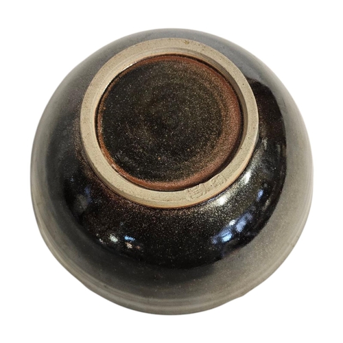 290 - A MID CENTURY ART POTTERY BOWL
iridescent glaze with leaf design,impressed mark to rim Initialed ‘SE... 