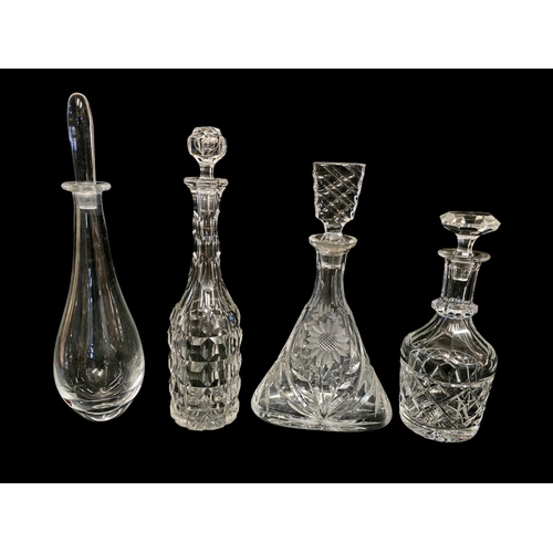 301 - ORREFORS, A MID CENTURY SWEDISH GLASS DECANTER
together with three cut lead crystal decanters.
Appro... 