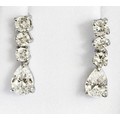 GIFTED BY LIAM GALLAGHER TO PATSY KENSIT, A PAIR OF 18CT WHITE GOLD SET ...