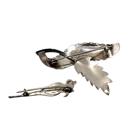 14 - A VINTAGE NORWEGIAN SILVER BROOCH
Scrolled leaf design, marked ‘Norway Sterling’, together with a si... 