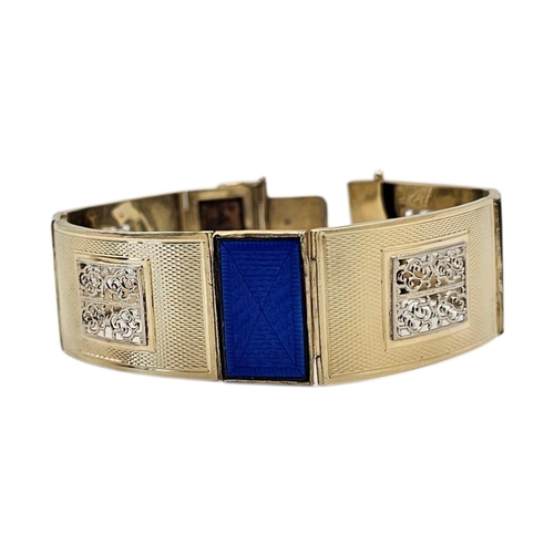 15A - AN ART DECO YELLOW METAL AND ENAMEL BRACELET
Alternating panels of vibrant Royal blue guilloché enam... 