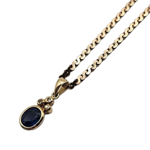 26A - A VINTAGE 9CT GOLD, SAPPHIRE AND DIAMOND PENDANT NECKLACE
Oval cut sapphire set with diamonds on twi... 
