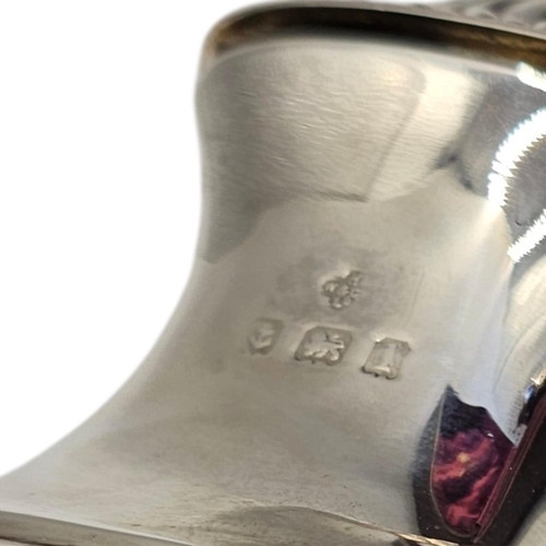 27 - A PAIR OF EARLY 20TH CENTURY SILVER PEPPERETTES
Classical form with fluted decoration, in a fitted v... 