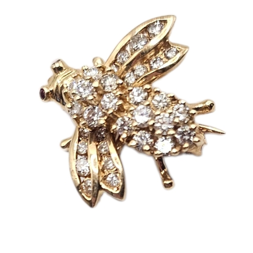 28A - A VINTAGE YELLOW METAL AND DIAMOND INSECT BROOCH
Set with graduated round cut stones and ruby eyes.
... 
