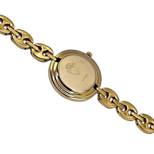 8A - GUCCI, A VINTAGE GOLD PLATED MARINER LINK LADIES’ WRISTWATCH
The circular white dial with gilt hands... 