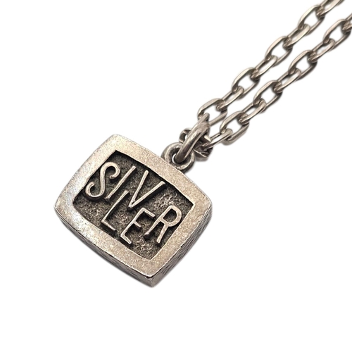21 - A VINTAGE SILVER ‘HALF OUNZE’ PENDANT NECKLACE
The rectangular form ingot on a plain silver necklace... 