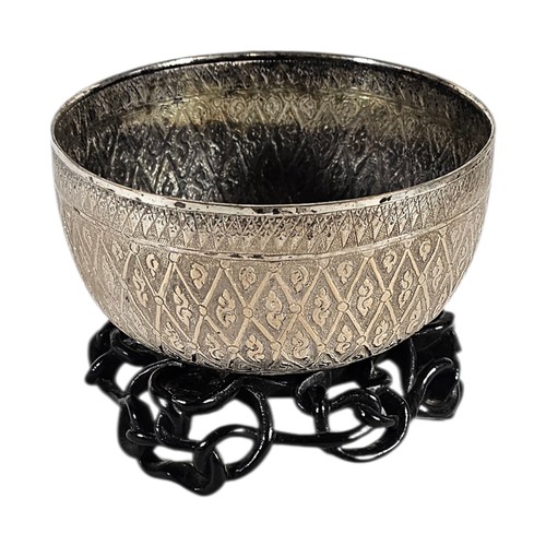 15A - AN EARLY 20TH CENTURY BURMESE SILVER BUDDHIST SINGING BOWL
Having fine engraved decoration.
(approx ... 