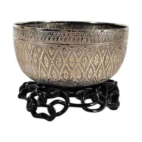 15A - AN EARLY 20TH CENTURY BURMESE SILVER BUDDHIST SINGING BOWL
Having fine engraved decoration.
(approx ... 