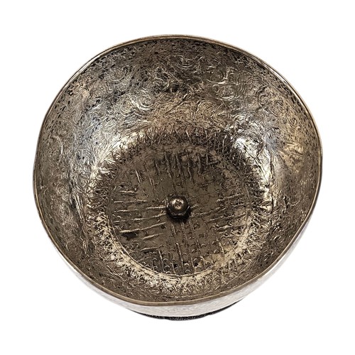 17A - AN EARLY 20TH CENTURY BURMESE SILVER BUDDHIST SINGING BOWL
Having fine engraved decoration, on hardw... 