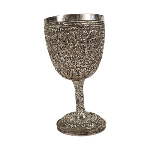 18A - A 19TH CENTURY ANGLO-INDIAN SILVER KUTCH GOBLET
Profusely chased with floral rosettes and scrolling ... 
