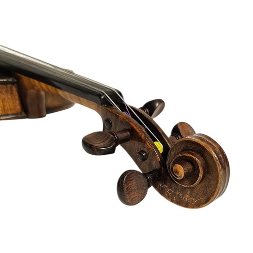 101 - A 19TH CENTURY GERMAN ¾ SIZE VIOLIN
Brown, length of back 33cm, overall 54cm, cased.

Condition: goo... 