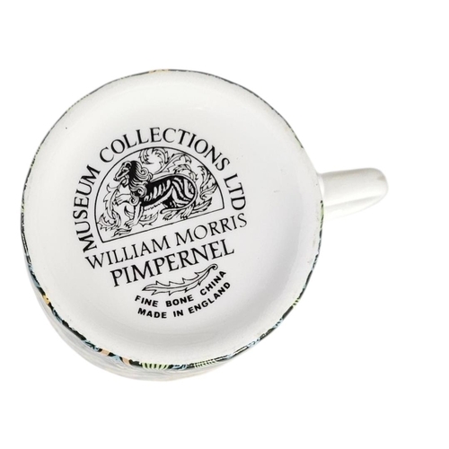 222 - A SET OF TEN WILLIAM MORRIS 'PIMPERNEL' DESIGN PORCELAIN COFFEE CANS
A fine set of eleven bone china... 