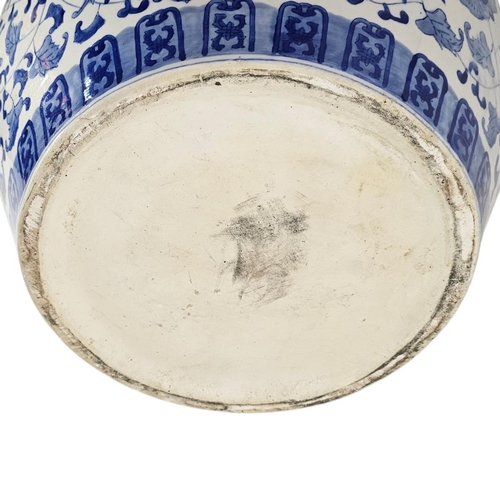 226 - A LARGE 20TH CENTURY CHINESE BLUE AND WHITE PORCELAIN FISH BOWL
Decorated in cobalt blue with scroll... 